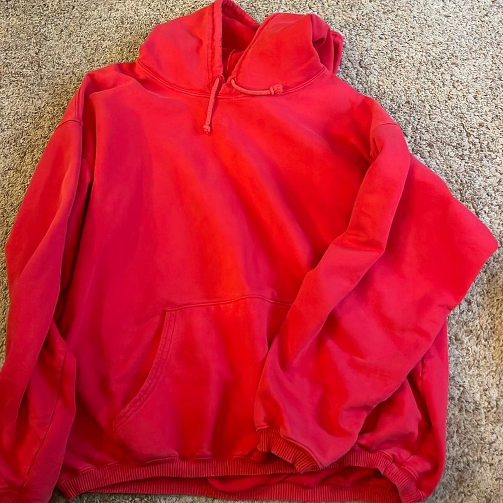 Red hoodie, unsure of size assuming it’s a large